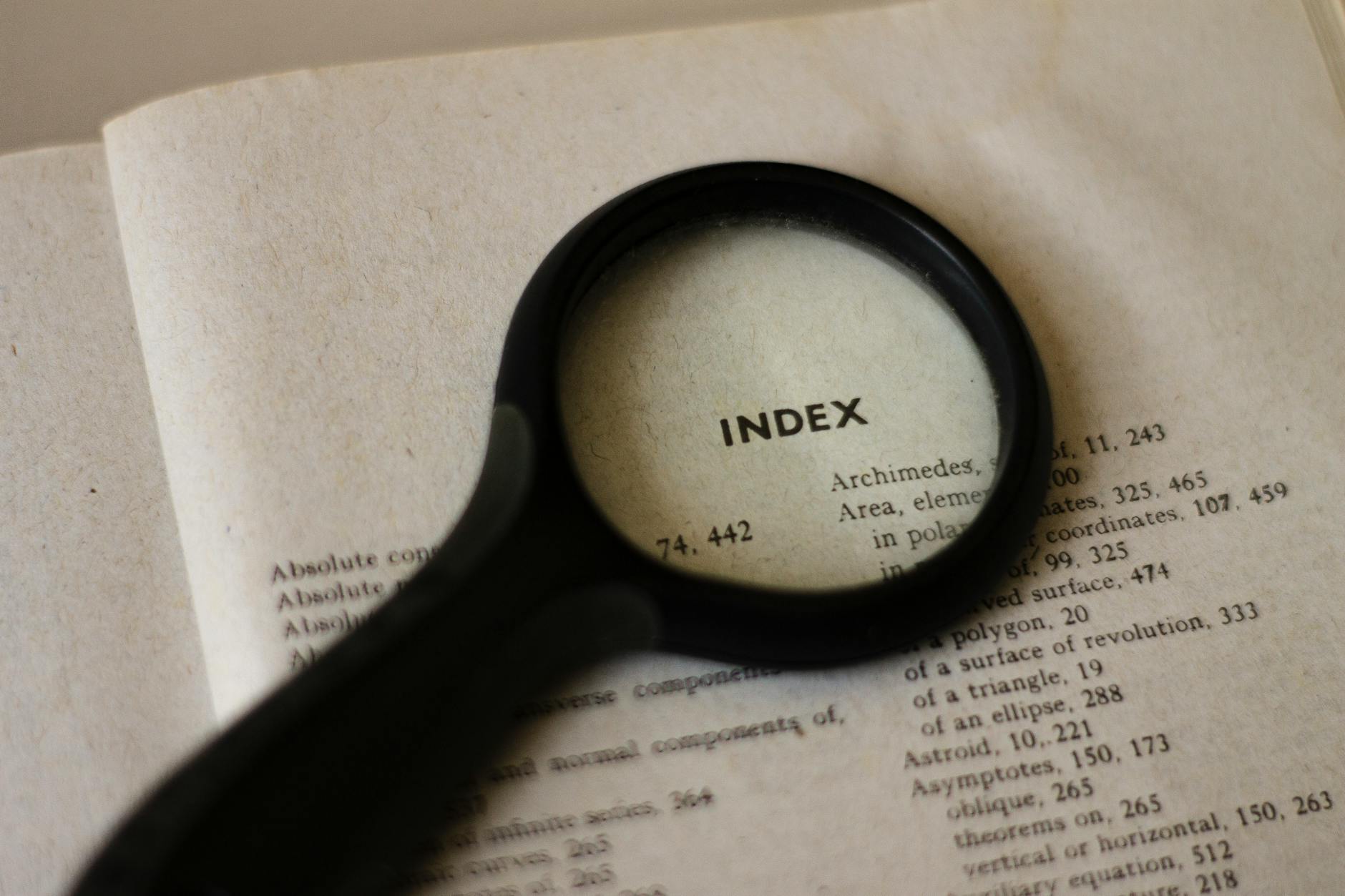 A magnifying glass over printed text — keyword research metaphor