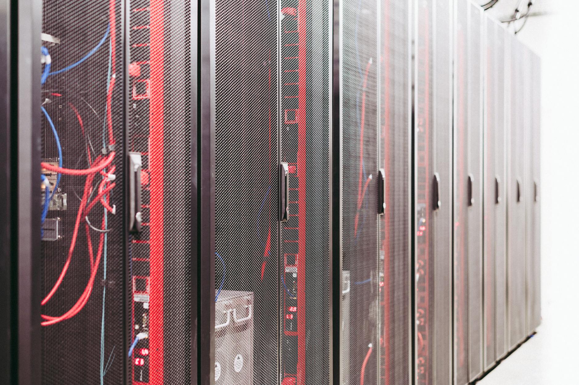 A row of server racks with red accent lighting